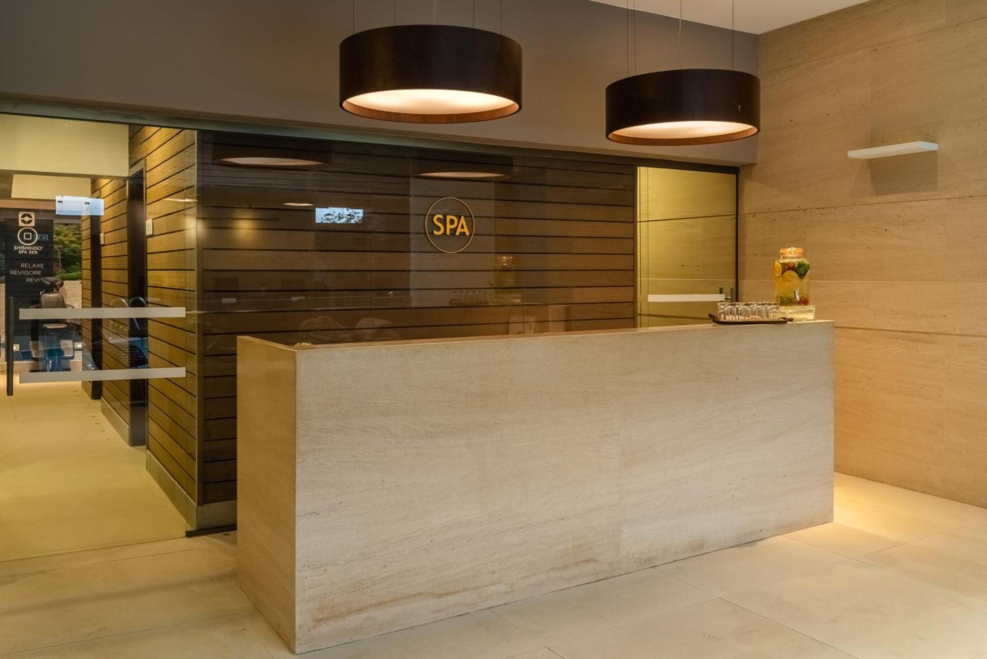 Bourbon Hotel & Suites Curitiba Exterior photo Spa reception desk